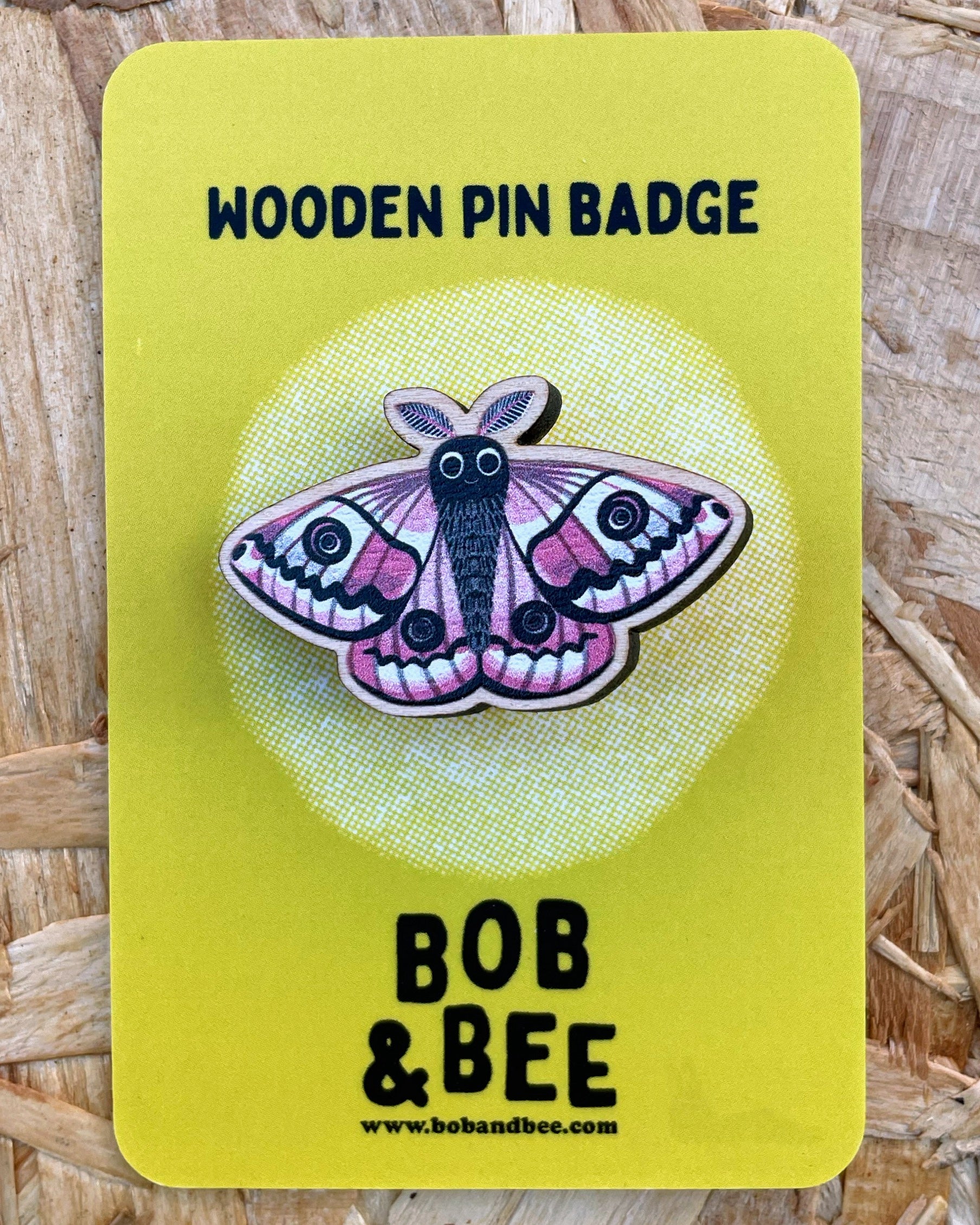 Wooden pin badge with an emperor moth design on a yellow card, branded 'Bob & Bee'.