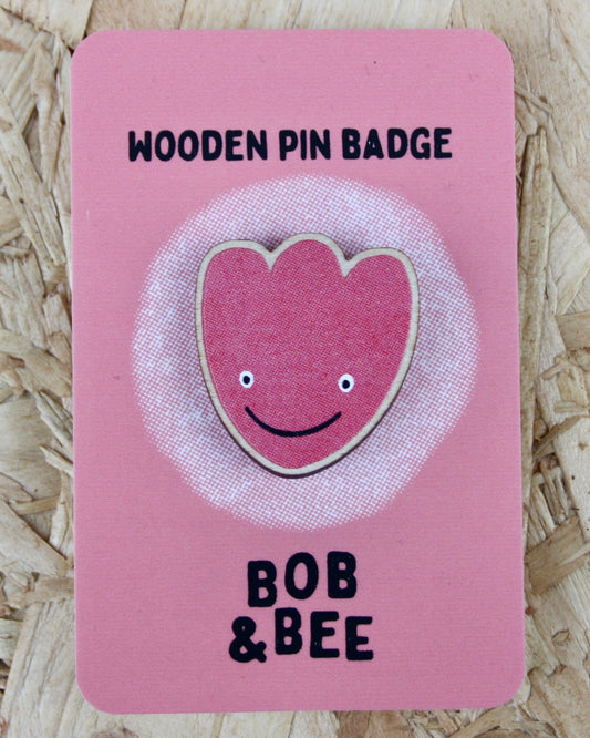 Pink tulip wooden pin badge with a smiling face design on a pink card, branded 'Bob & Bee'.